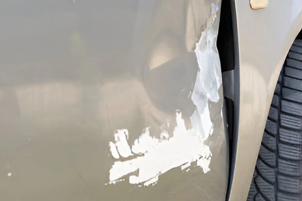 Door dent before paintless dent removal
