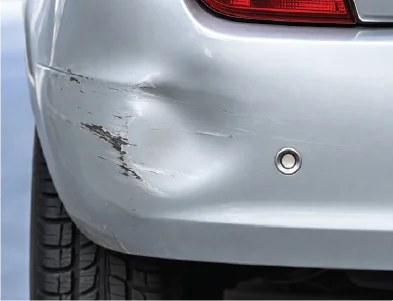 Bumper dent before repair